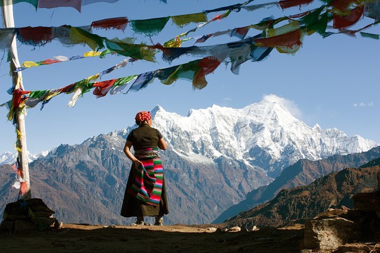 Nepalese Woman And Langtang Peak